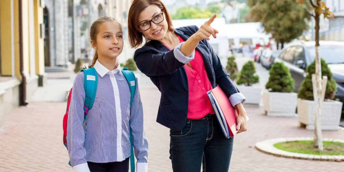 outdoor-portrait-of-schoolgirl-and-teacher-2021-12-27-20-08-08-utc