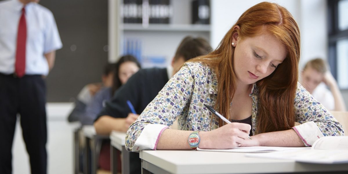 teacher-watching-over-teenagers-in-classroom-2022-03-07-23-56-07-utc 2